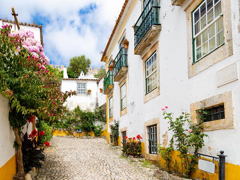 Traditional whitewashed buildings in the town of Óbidos, Portugal